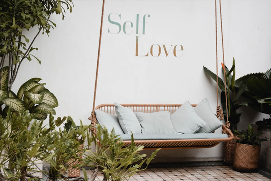 Self-love written on a wall.