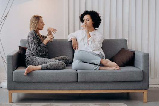 Two girls drinking water